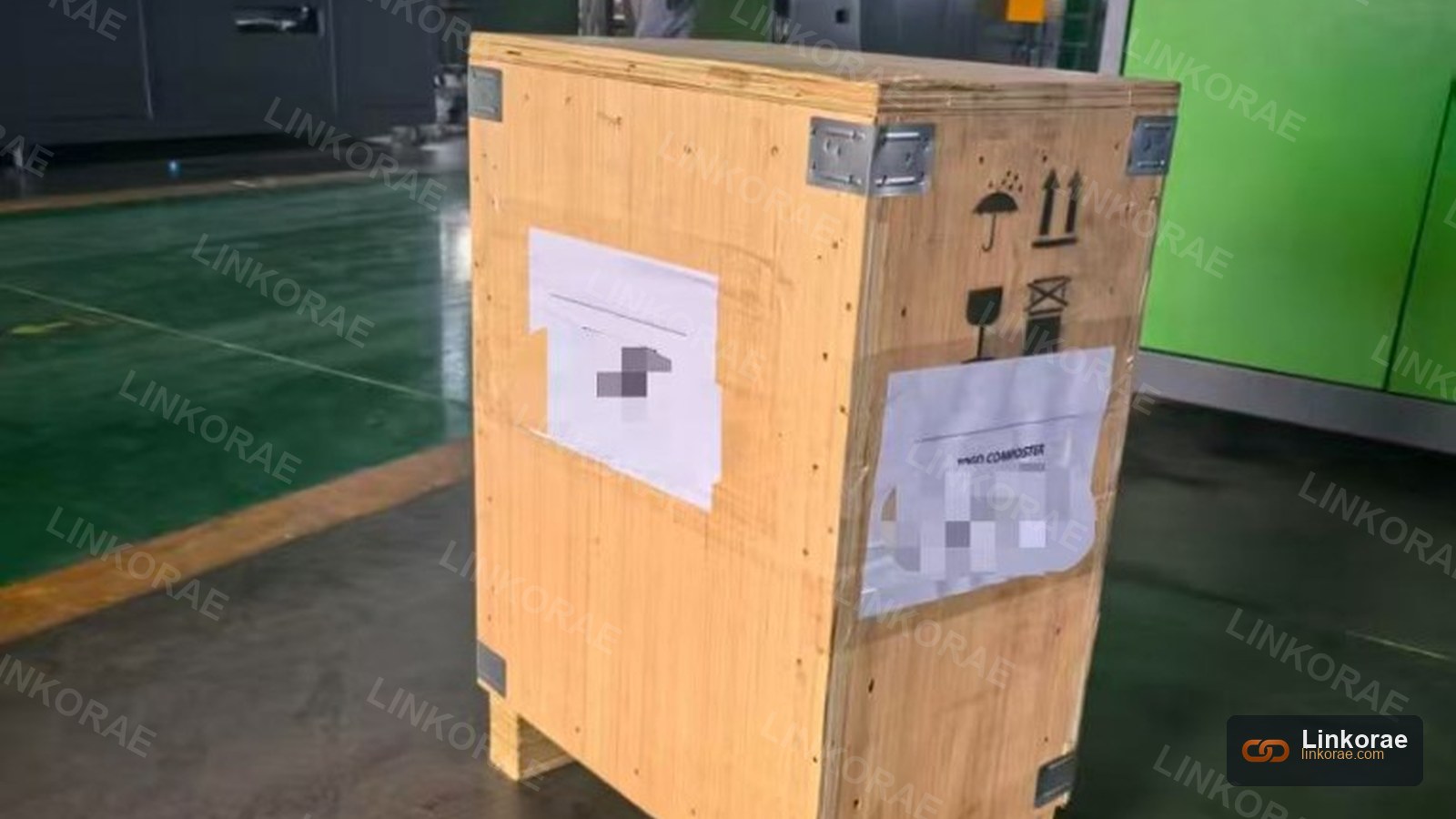 A plywood export crate with handling marks — packing decided at origin determines what can happen at delivery
