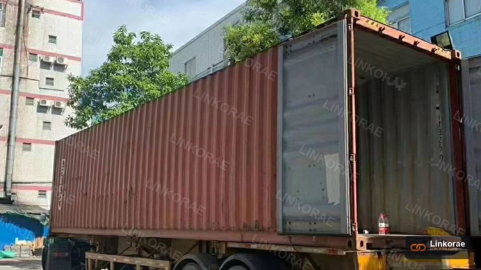 An open container on a chassis — the cargo did not change when the July tariff did