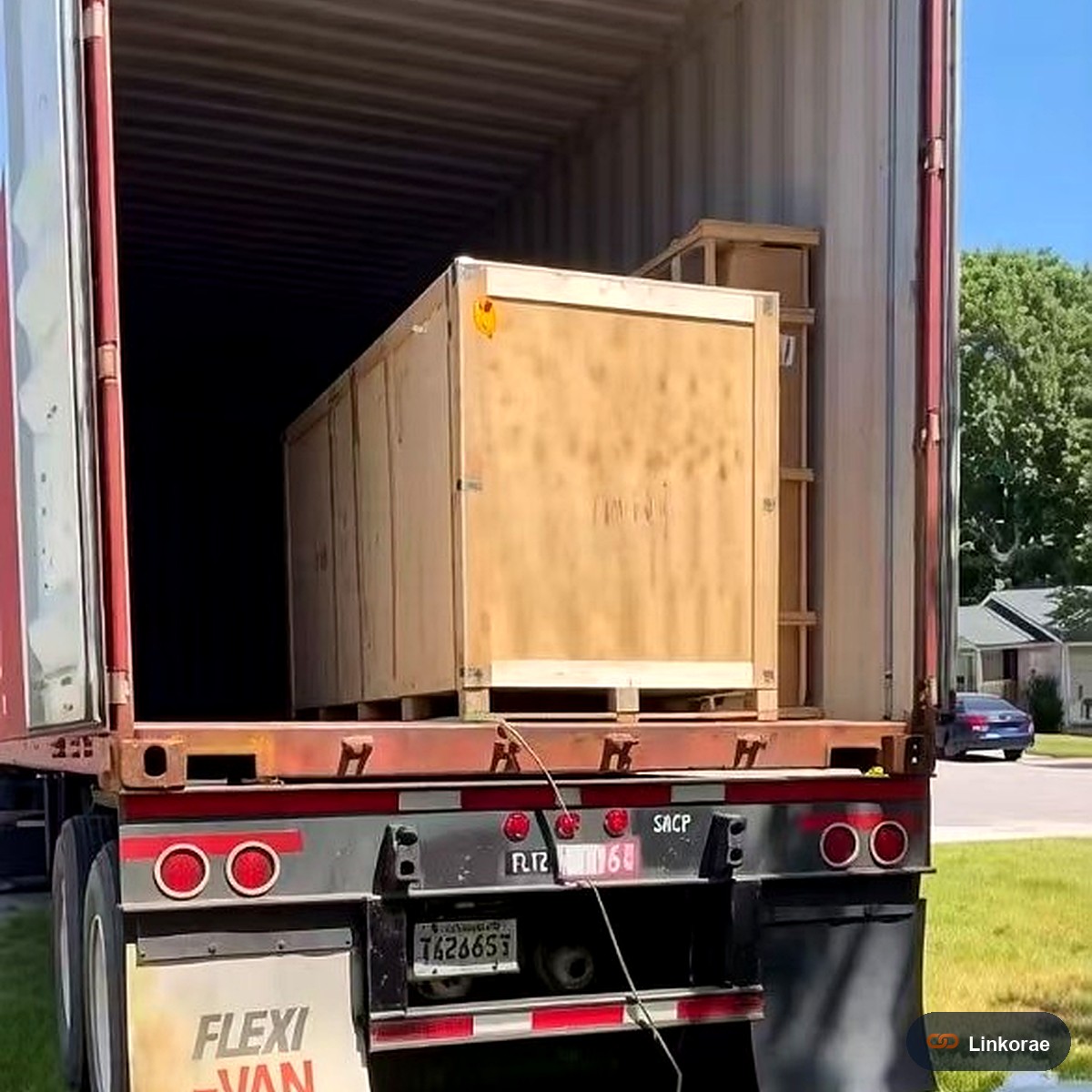 Wooden crate being unloaded from a trailer at a US house