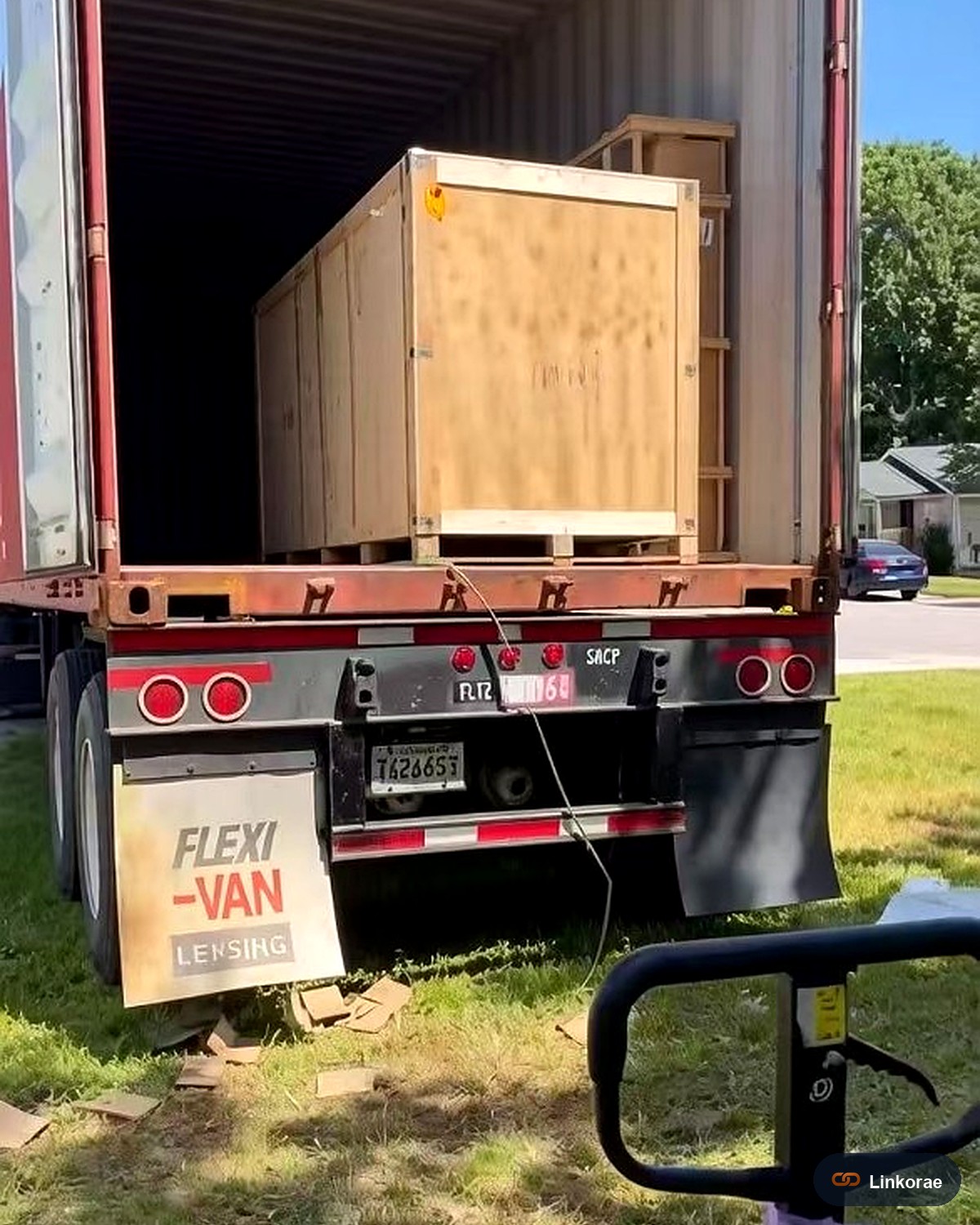 Wooden crate being unloaded from a trailer at a US house